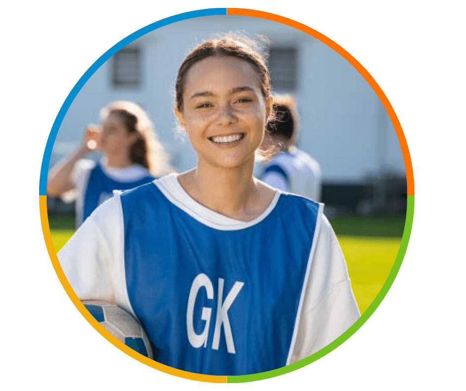 Two women hugging and smiling joyfully while taking a selfie together. 